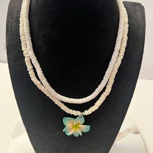 Two Elegant White Necklaces with a Floral Pendant